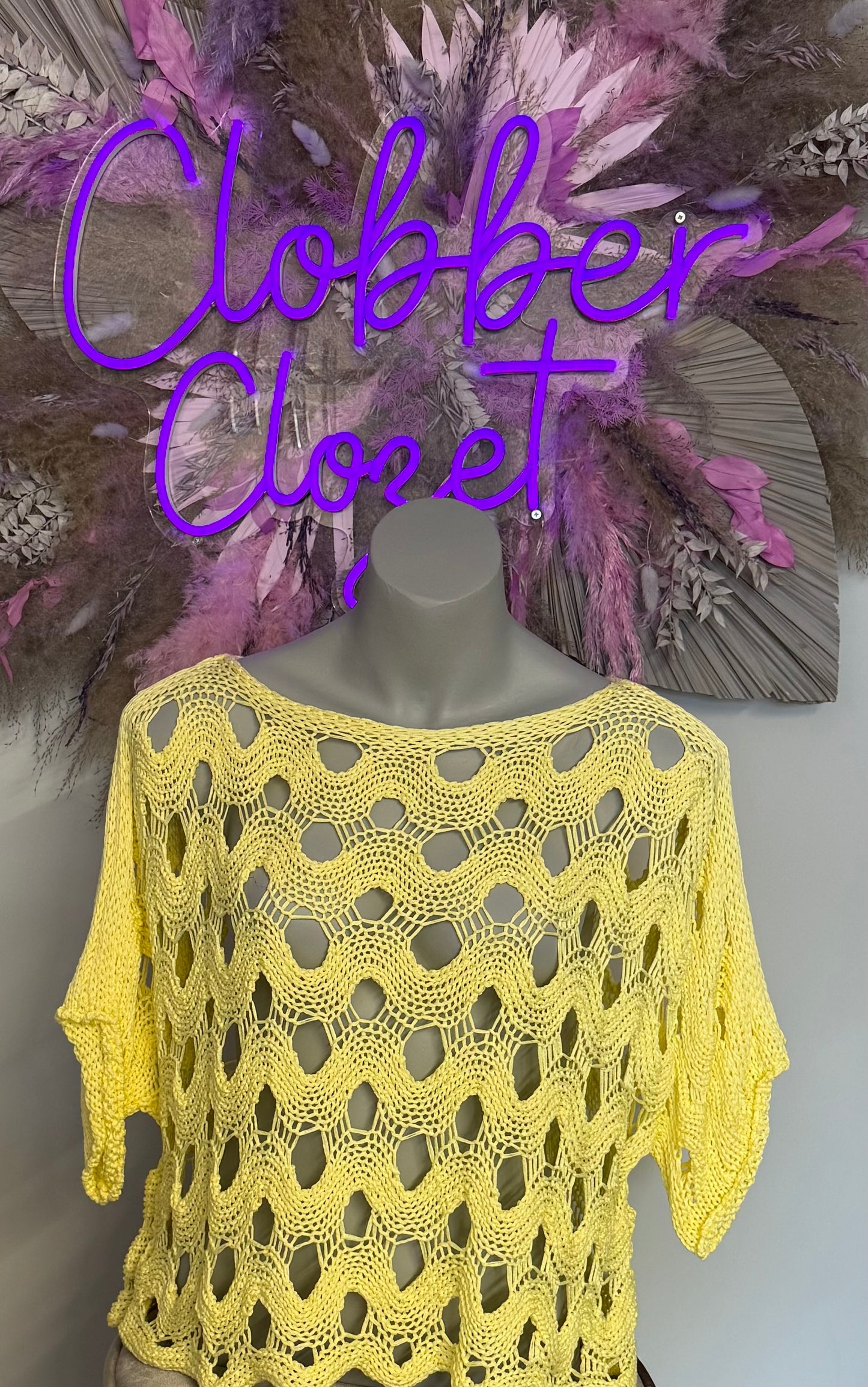 Photo of Half Body Mannequin wearing Oversized Crochet Top in Yellow.