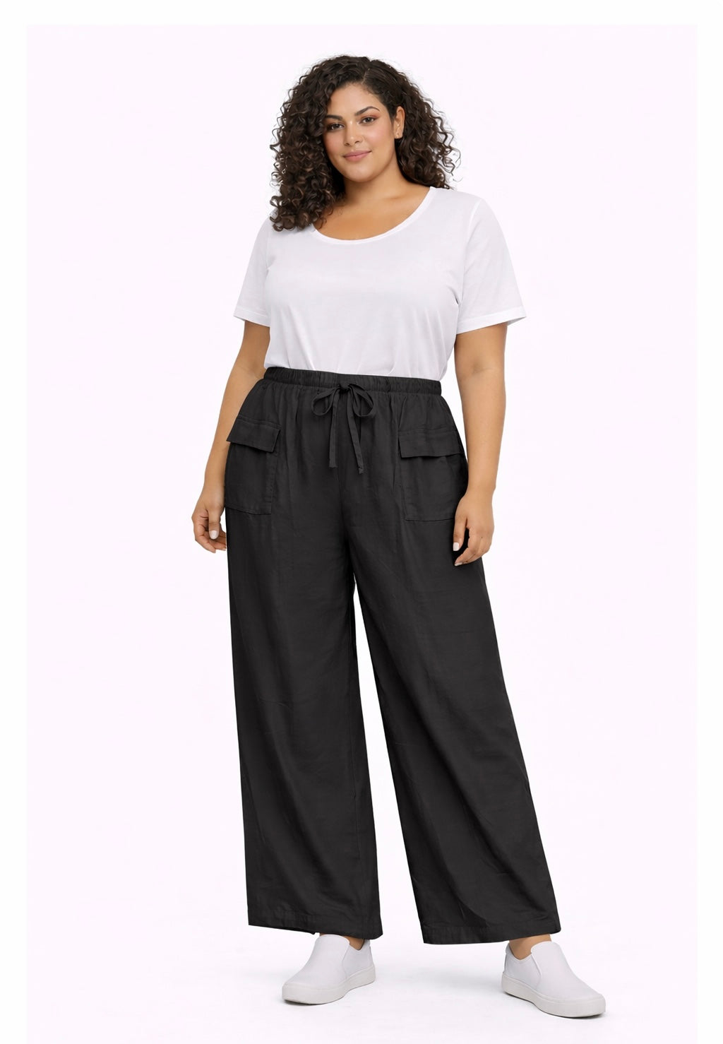 Woman wearing a white t-shirt and black Plus Size Lightweight Wide Leg Cargo Trousers with Pockets on a white background