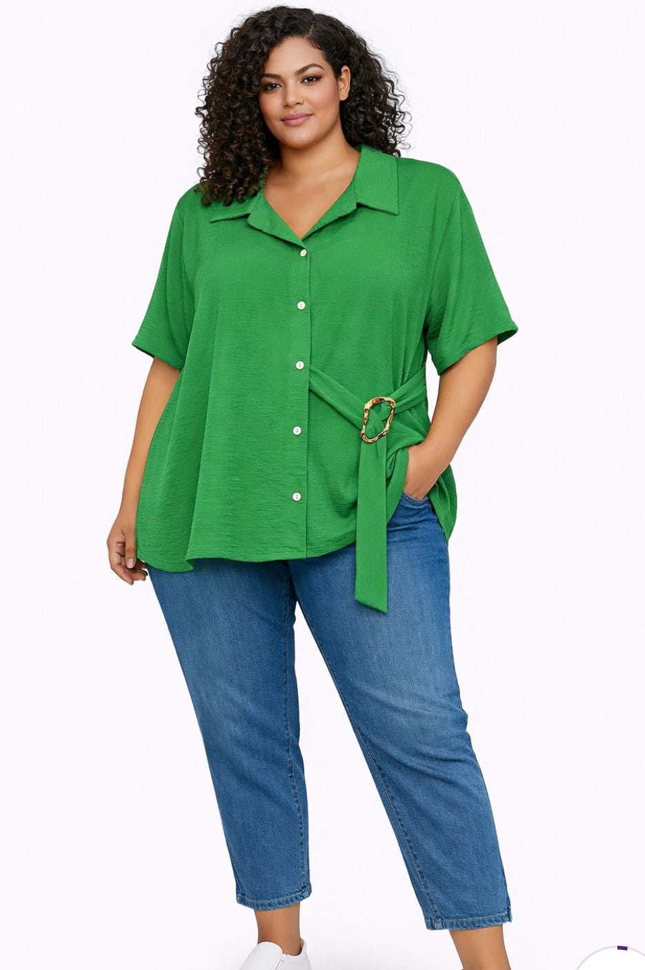 Woman wearing a green Plus Size Textured Belted Button-Through Shirt Top blue jeans on a white background