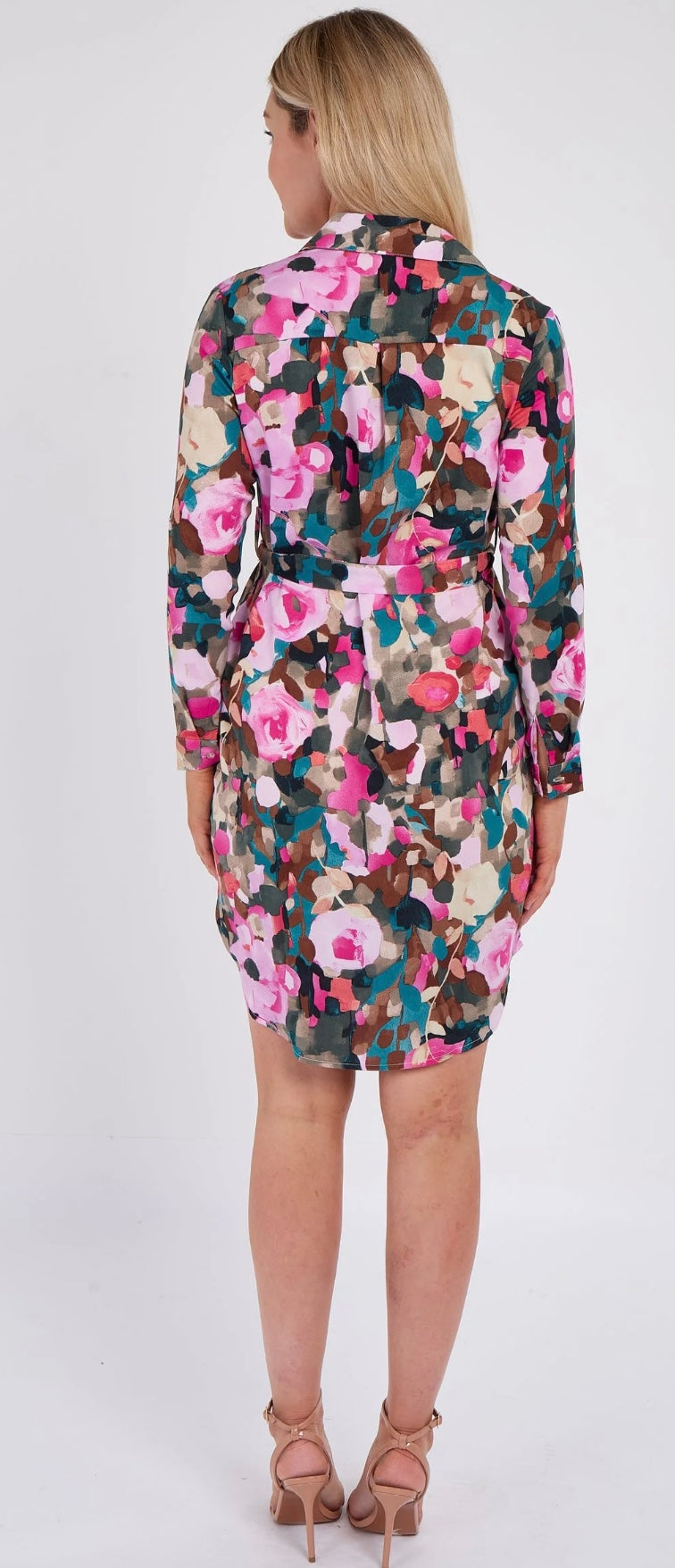 Woman wearing a floral dress on a white background