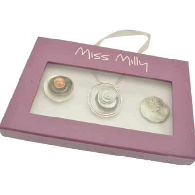 Jewelry set in a 'Miss Milly' branded box on a white background