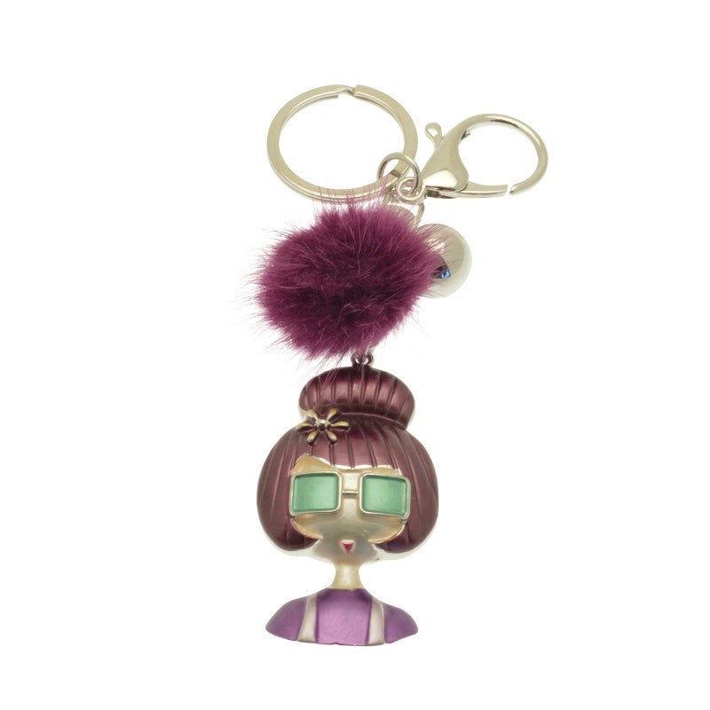 Keychain with a character design featuring a purple hair accessory on a white background