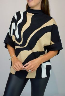 Woman Wearing Camel, Black and White High Neck Contrast Swirl Light Knit Jumper