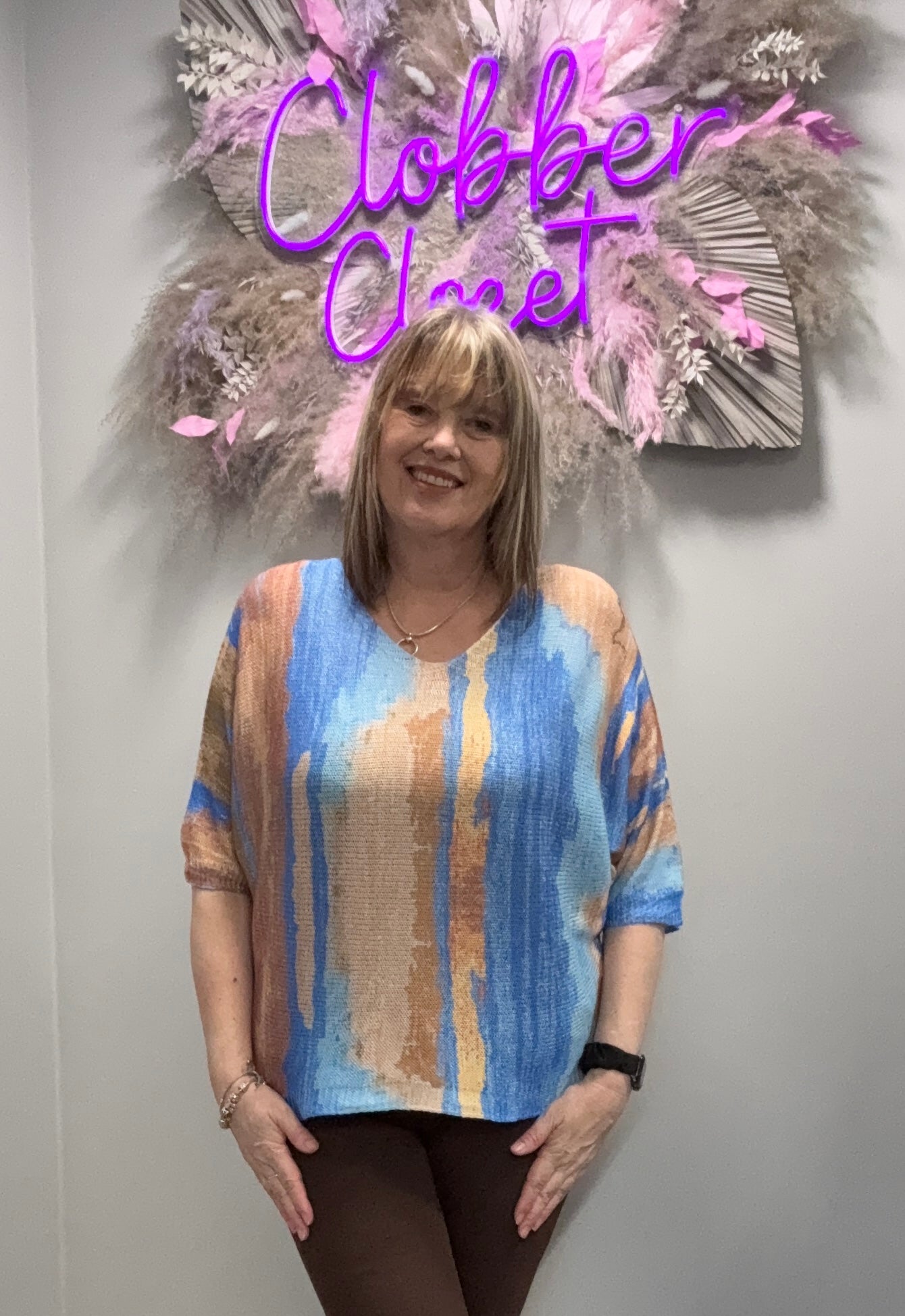 Woman Wearing Kurt Muller Marble Print V Fine Mesh Knit Top in Blue 