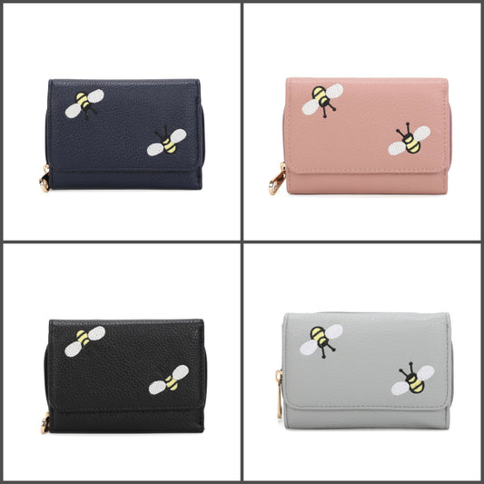 Four wallet options in a 2x2 grid: navy blue, dusty pink, black, and light gray wallets, each with a gold-tone zipper and two embroidered bumblebee motifs on the front flap.