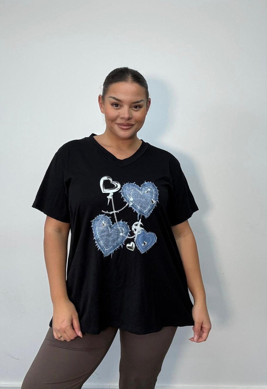 Person wearing a Black Plus Size Denim Heart
Graphic Oversized T-Shirt on a plain background