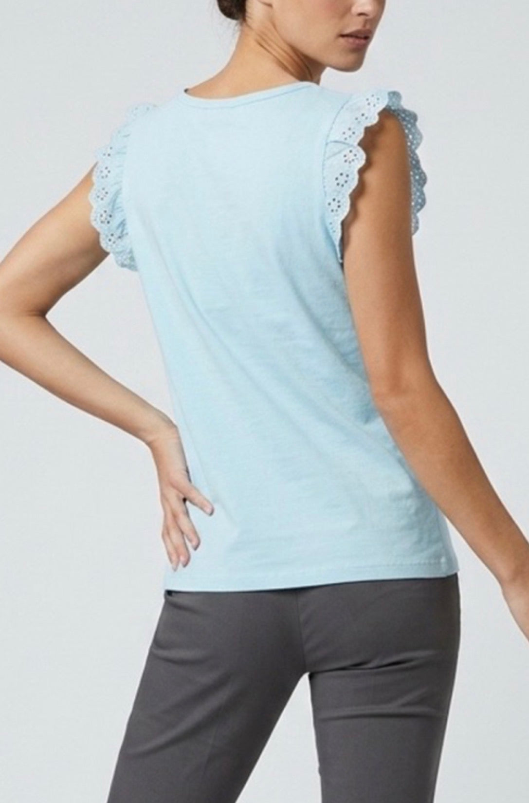 Back view of Light blue sleeveless top with lace details worn by a person on a plain background