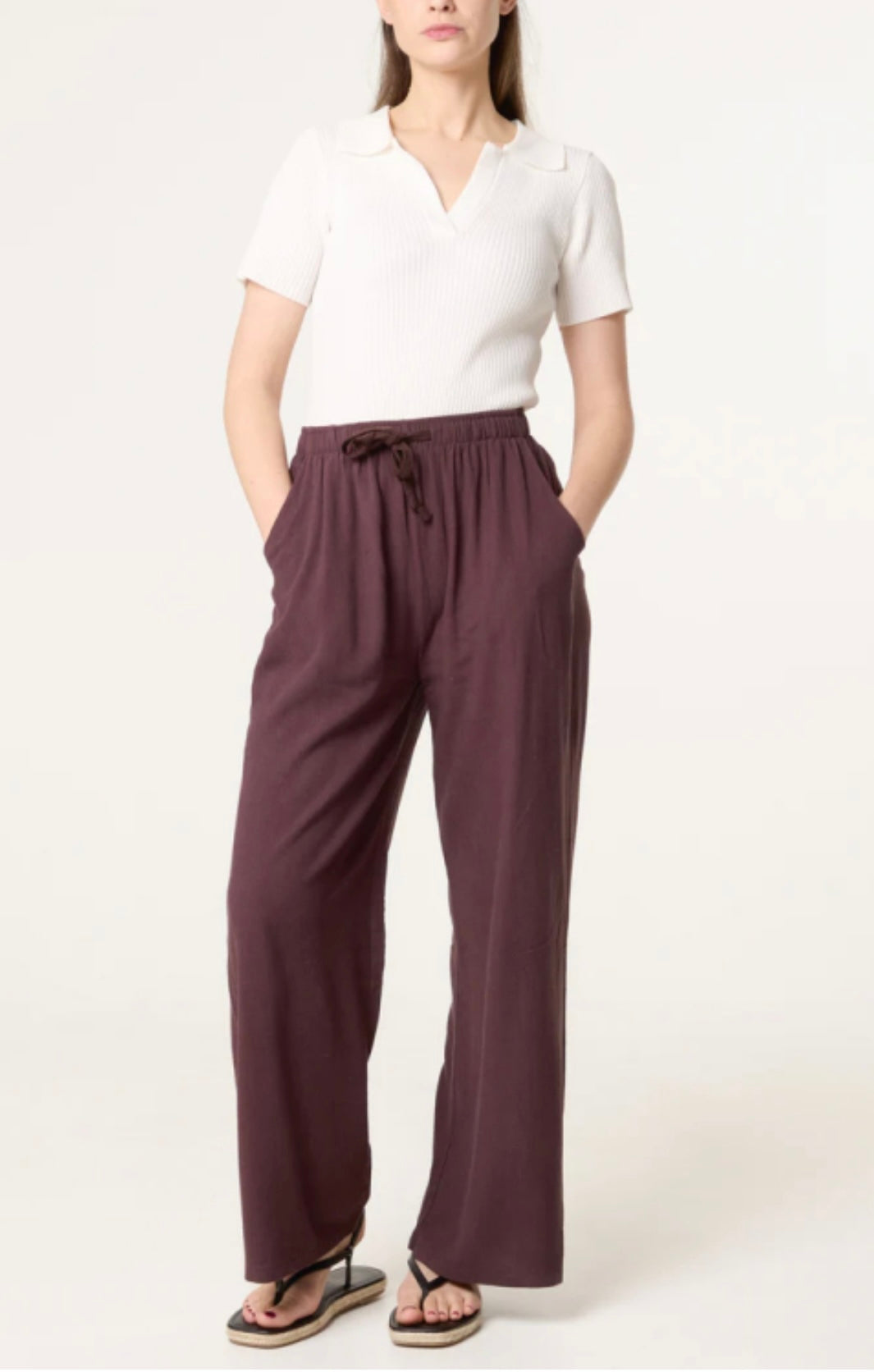 Woman wearing a white top and Brown Linen Blend Drawstring Pocket Trousers on a white background