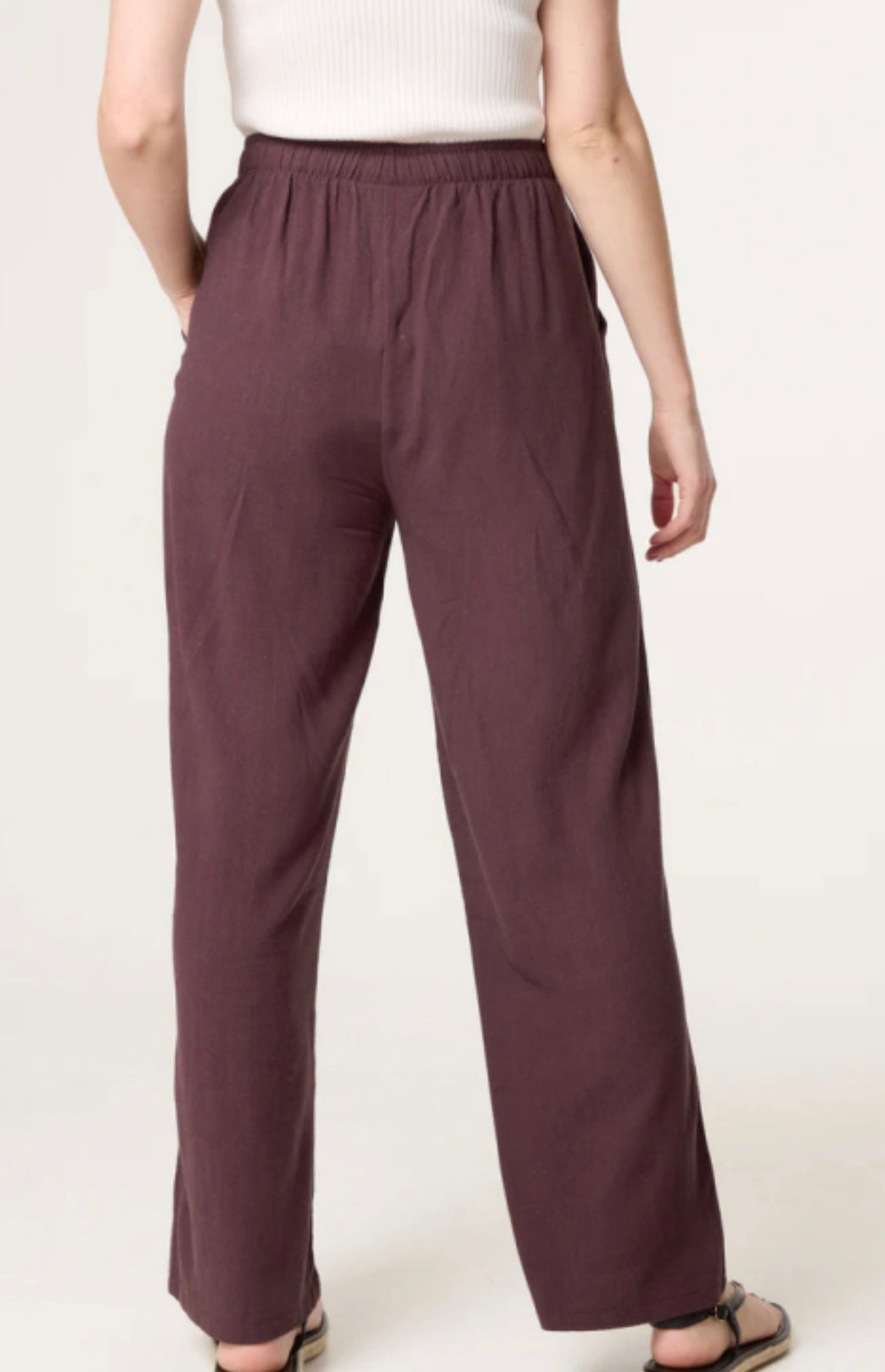 Person wearing Brown Linen Blend Drawstring Pocket Trousers on a white background