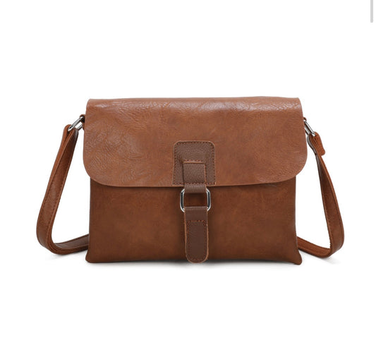 A brown faux-leather crossbody bag with a front flap and a central buckle strap, shown on a plain white background.