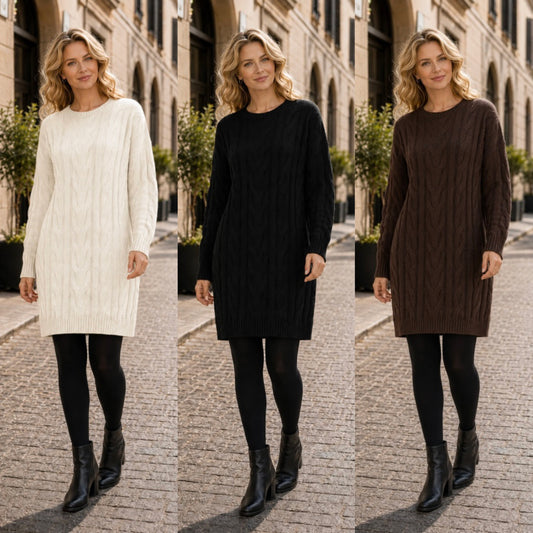 Three women standing outdoors on a cobblestone street wearing cable-knit sweater dresses in white, black, and brown, paired with black tights and ankle boots.
