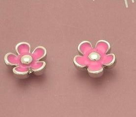 Pair of fuchsia pink flower-shaped earrings on a pink background