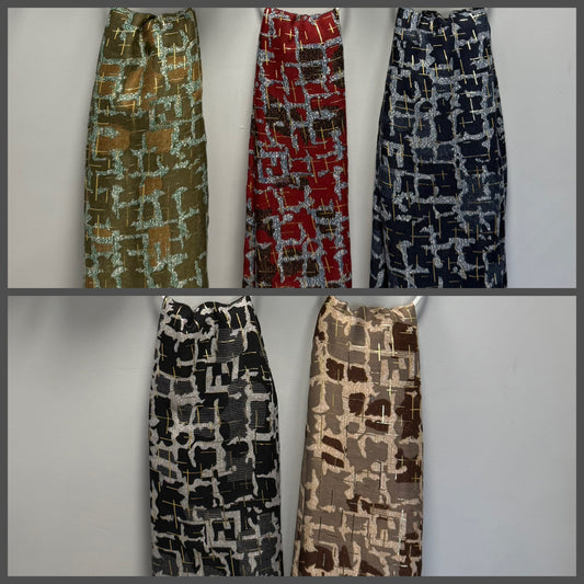 Five women's gold foil detail scarves with abstract geometric block patterns are displayed side-by-side in different colorways against a plain light gray background.