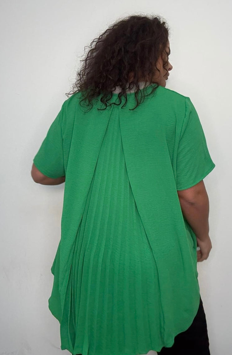 Person wearing a Green Plus Size Pleated Back Oversized T-Shirt with Pockets against a white background