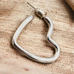 Close Up of Jess & Lou Silver Hollow Heart Stud Earring