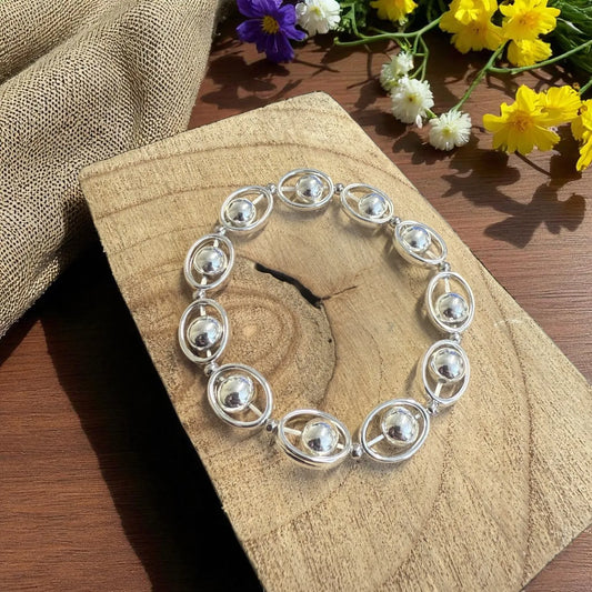 Silver Orbit Beads on Stretch Bracelet