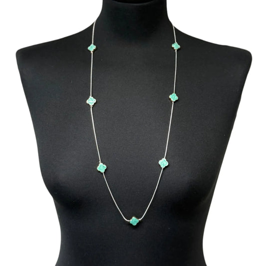 Jess & Lou Blue Clover Pearlescent Necklace on a black mannequin