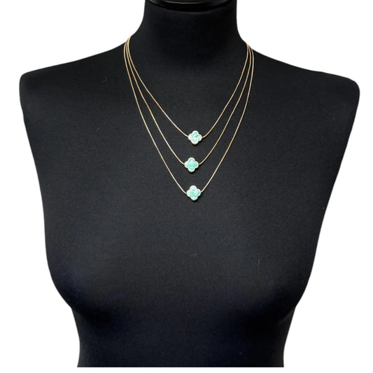 Jess & Lou Blue Multi-Layer Clover Pearlescent Necklace on a black mannequin bust.