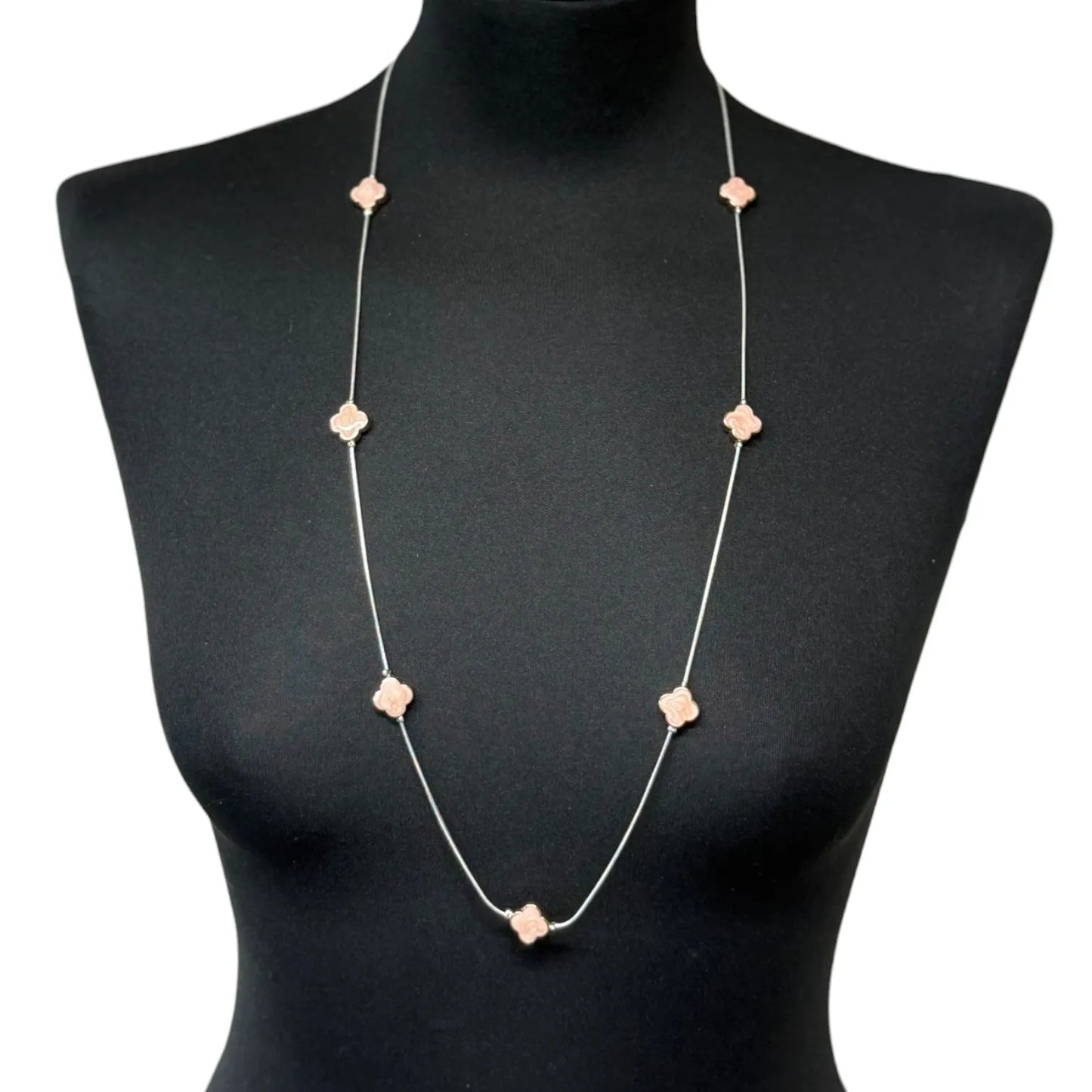 Jess & Lou Pink Clover Pearlescent Necklace on a black mannequin