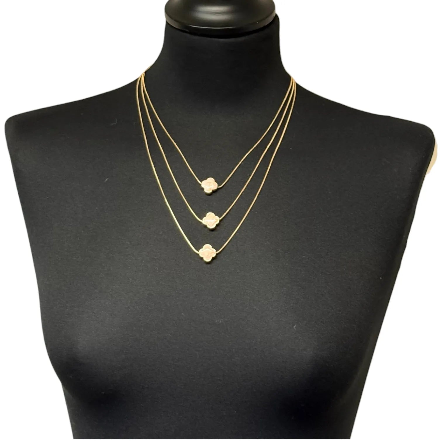 Jess & Lou Pink Multi-Layer Clover Pearlescent Necklace on a black mannequin bust