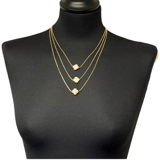 Jess & Lou Pink Multi-Layer Clover Pearlescent Necklace on a black mannequin bust