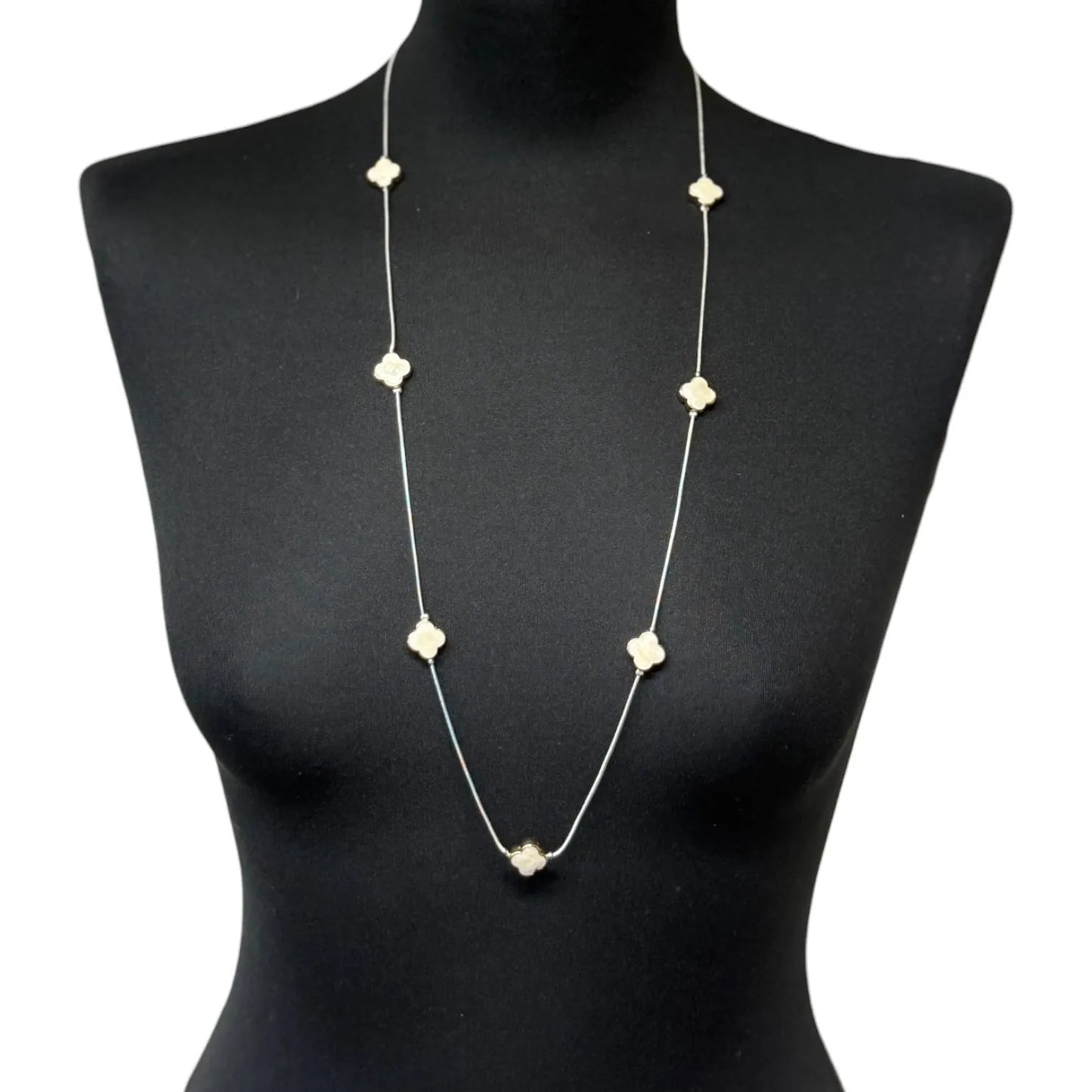 Jess & Lou White Clover Pearlescent Necklace on a black mannequin