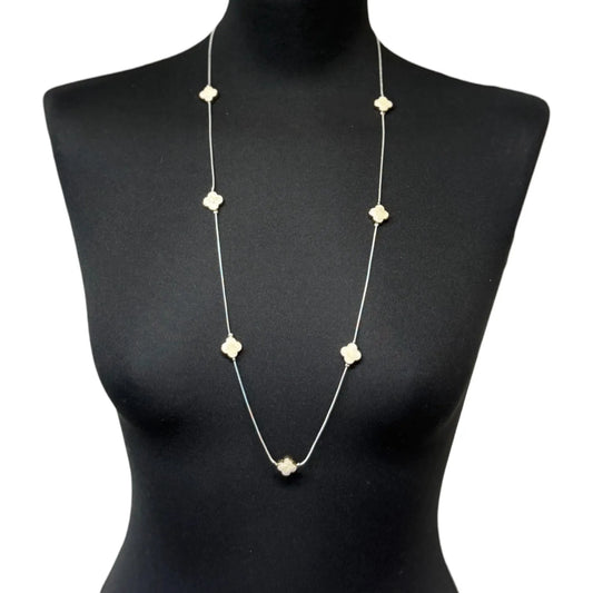 Jess & Lou White Clover Pearlescent Necklace on a black mannequin