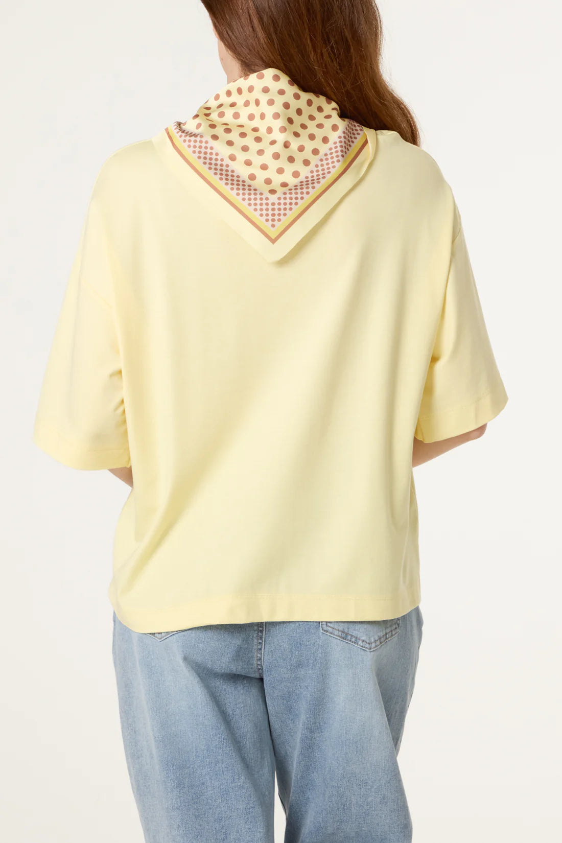 Person wearing a Lemon Yellow Back Polka Dot Scarf Short Sleeve T-Shirt against a white background