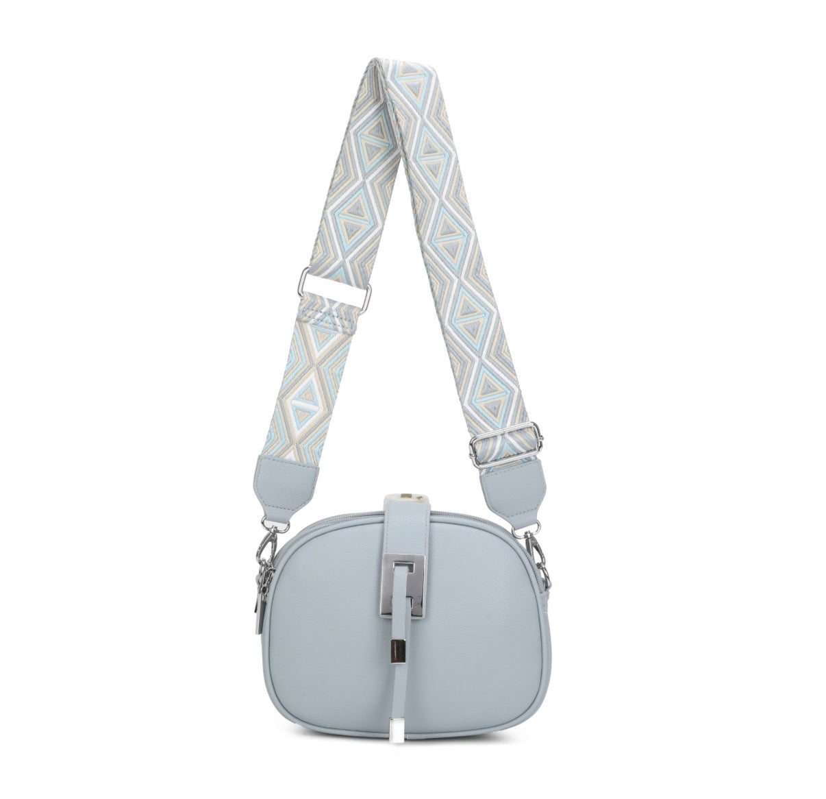 Light blue handbag with a patterned strap on a white background