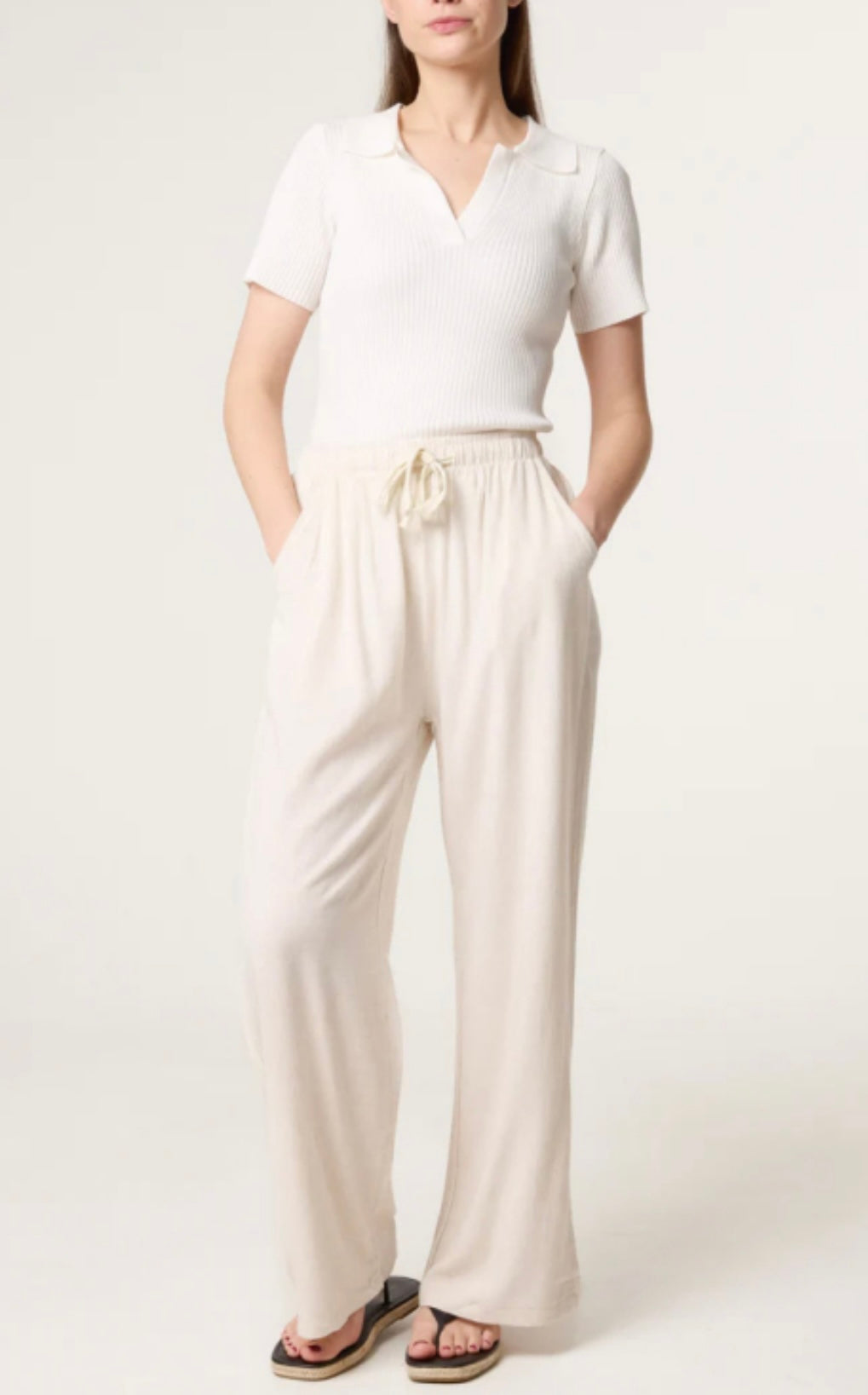 Person wearing a white top and beige Linen Blend Drawstring Pocket Trousers on a plain background
