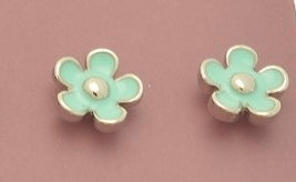 Pair of mint green flower-shaped earrings on a pink background