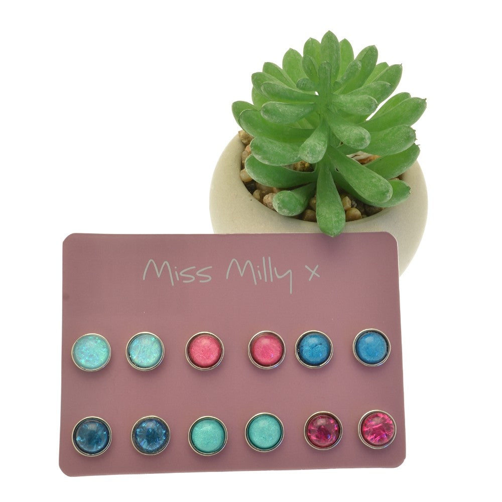 Set of colorful stud earrings on a 'Miss Milly x' card with a small potted succulent.