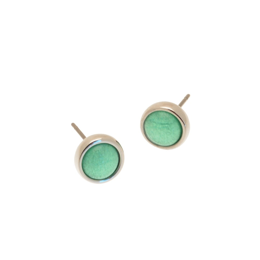 Pair of green round stud earrings on a white background