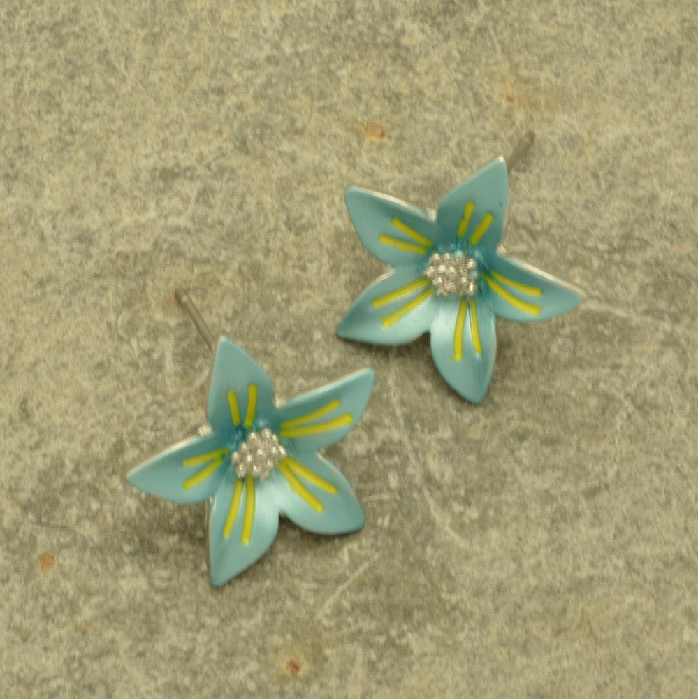 Miss Milly Turquoise Flower Earrings On display with textured background 