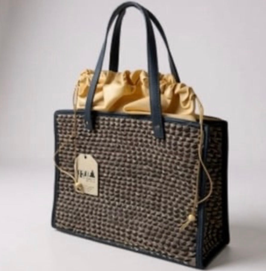 Niven McCarthy Bali Collection - Sumatra Black & Gold Palm Weave Tote Bag On a white backgrsound.