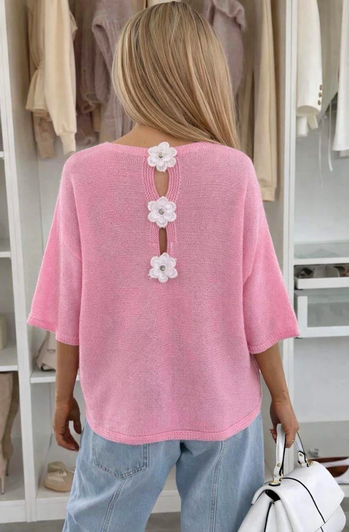 Back View of Woman wearing Pink Floral Appliqué Lightweight Open-Knit Fabric Knitted Jumper 