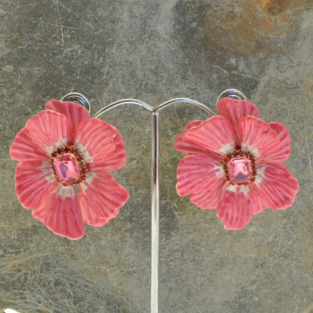 Miss Milly Pink Flower Statement Earrings on display stand with textured background 