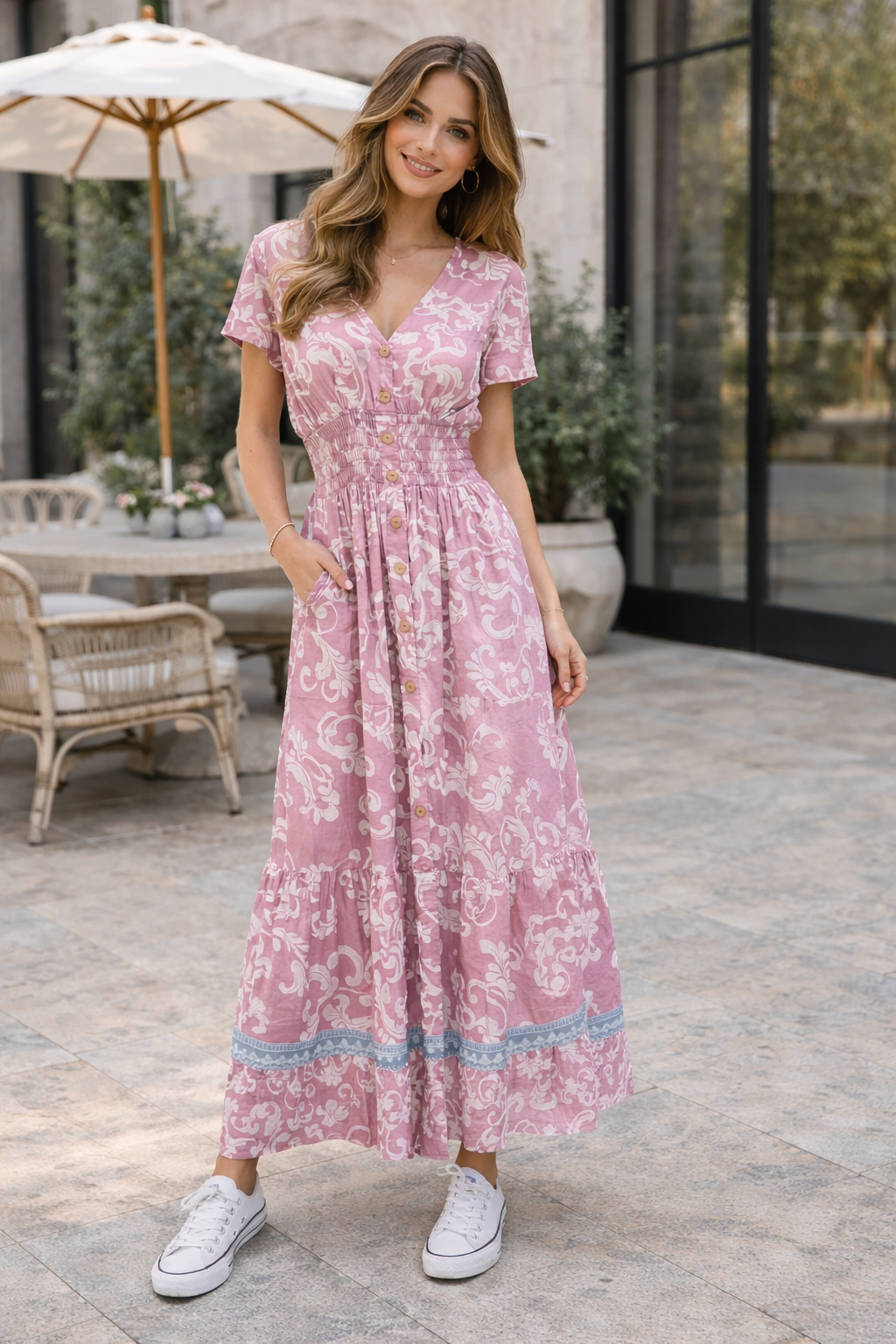 Woman wearing a pink Retro V Neck Floral Maxi Dress standing outdoors.