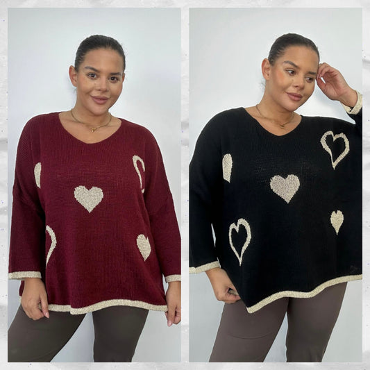 Two images of a woman wearing heart-patterned sweaters in red and black.