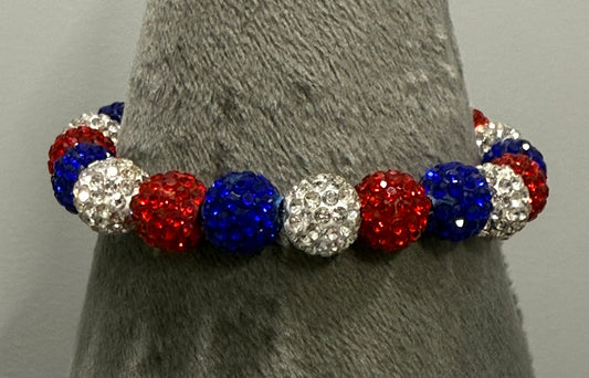 Red, White and Blue Shamballa Stretch Bracelet on grey background 