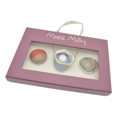 Pink packaging box with 'Miss Milly' branding containing three small containers.