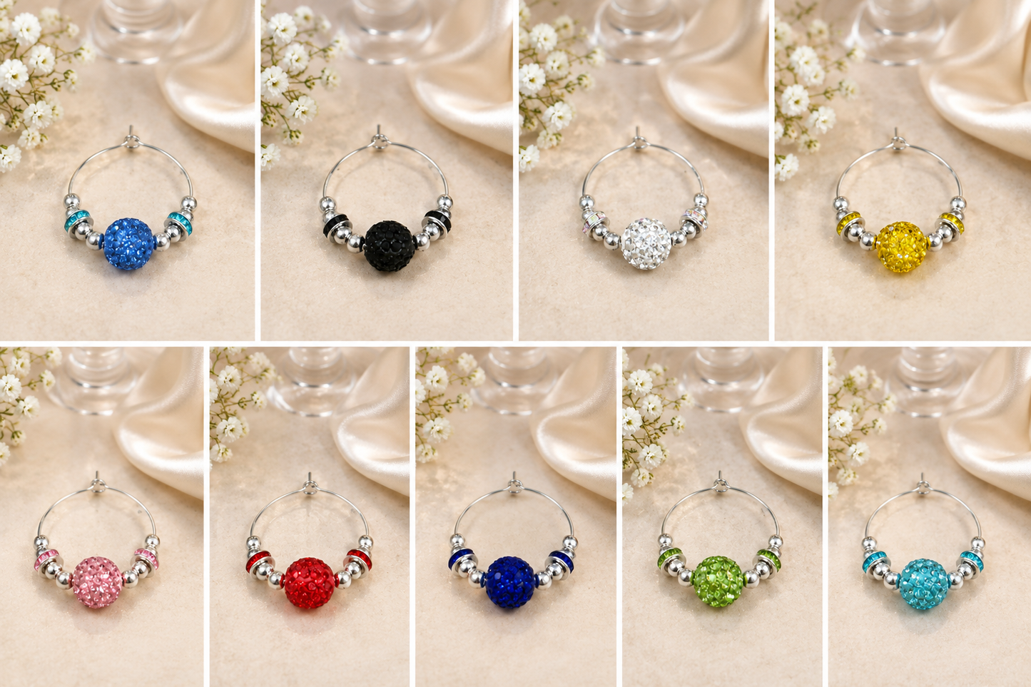 A collage of ten wine glass charms, each a silver-tone ring with a round faceted gemstone in a different color (blue, black, white/silver, yellow, pink, red, dark blue, green, light blue, and teal) and small metallic spacer beads, displayed on a beige satin fabric with white flowers and glassware in the background.