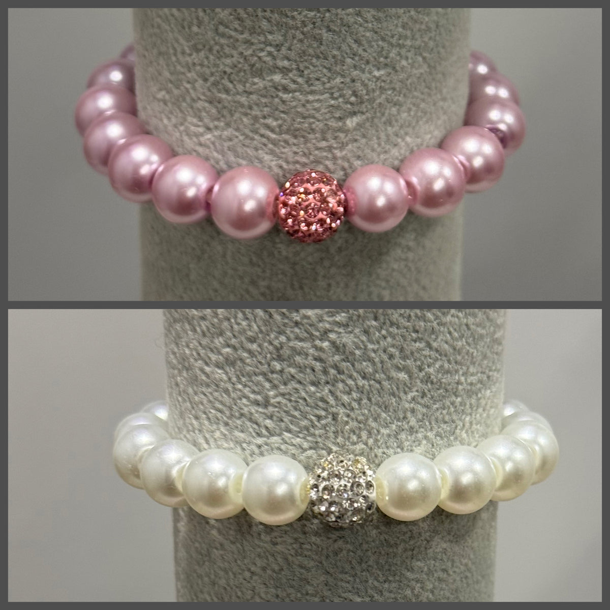 Two pearl beaded stretch bracelets displayed on a gray jewelry stand. The top bracelet features light pink pearls with a central pink rhinestone-encrusted bead.