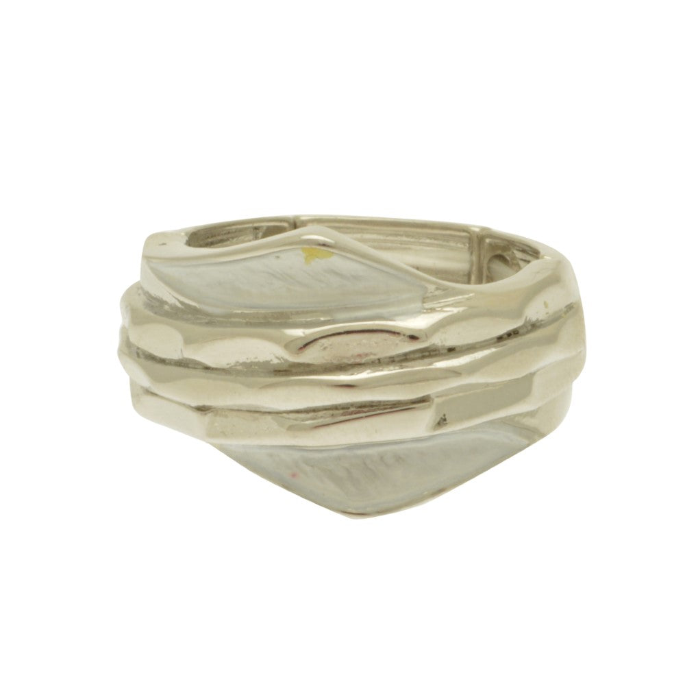 Silver ring with wavy design on a white background