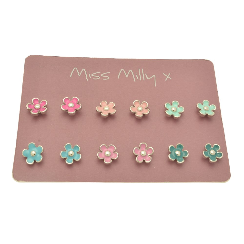 Set of flower-shaped earrings on a pink card with 'Miss Milly' branding.