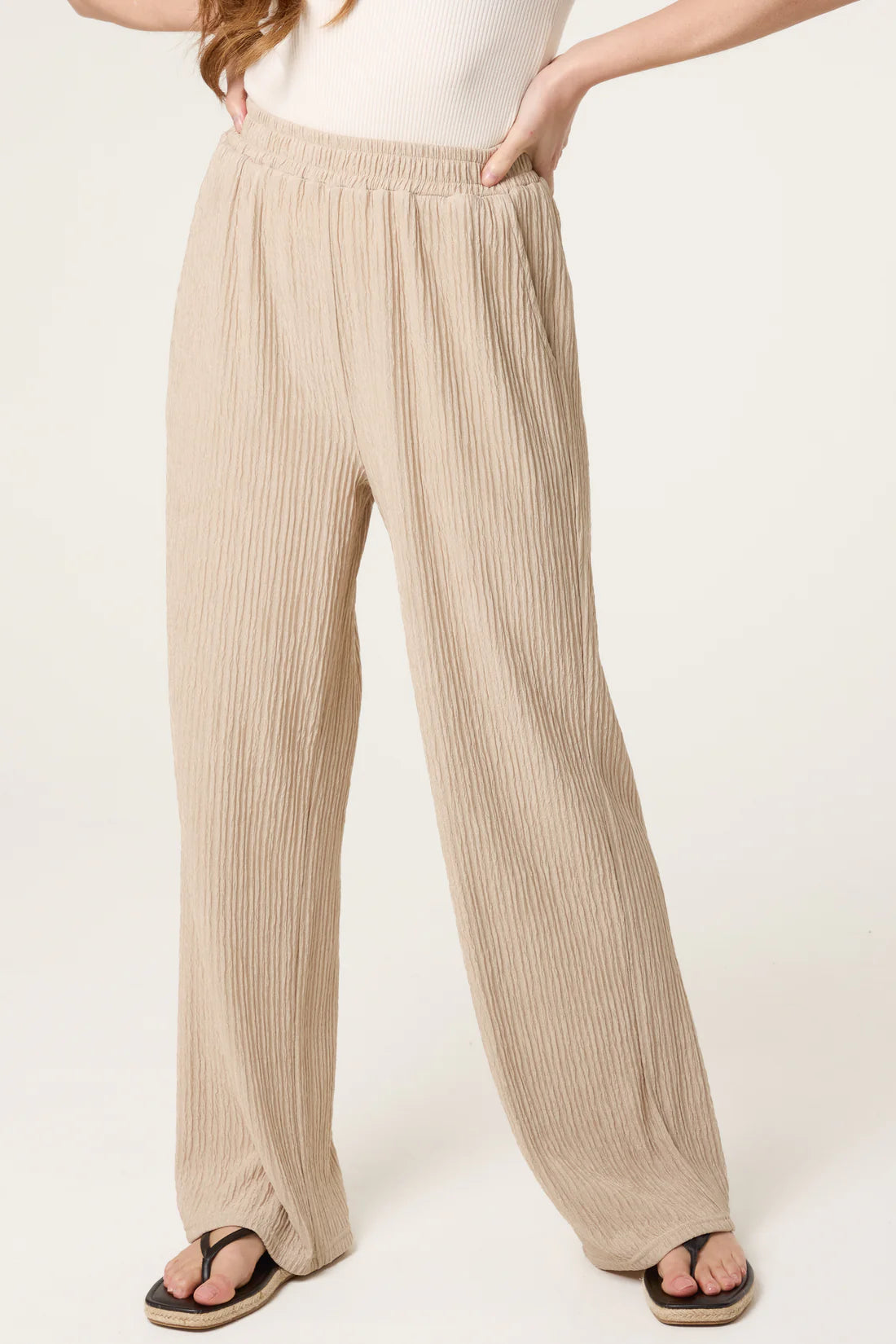 Stone Beige Elastic Waist Crinkle Trousers worn by a person on a white background