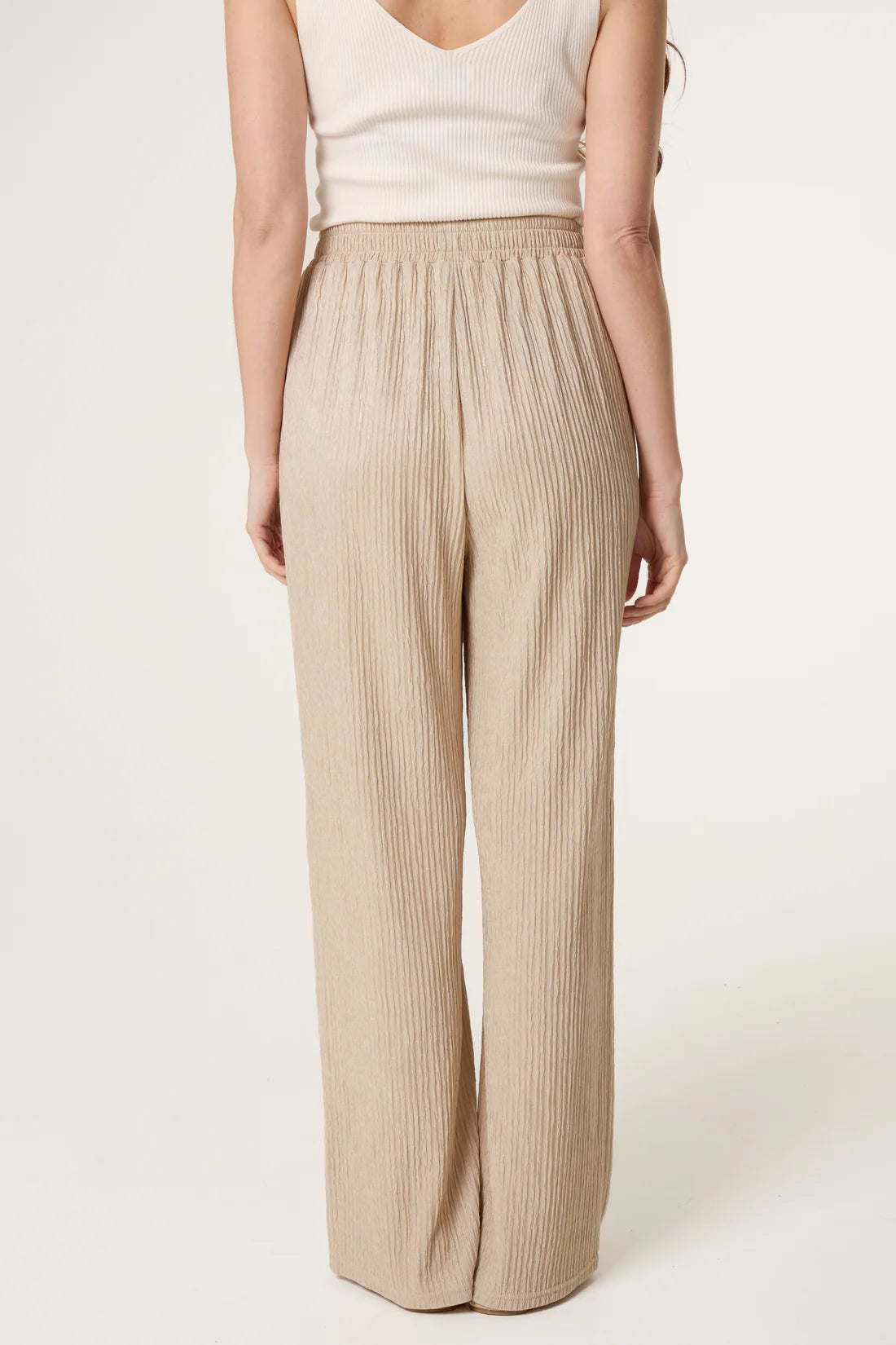 Stone Beige Elastic Waist Crinkle Trousers worn by a person on a white background