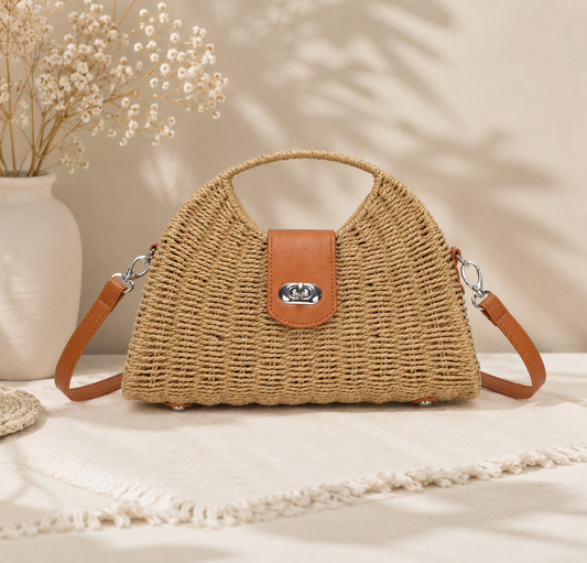 Woven handbag with brown leather accents on a neutral background