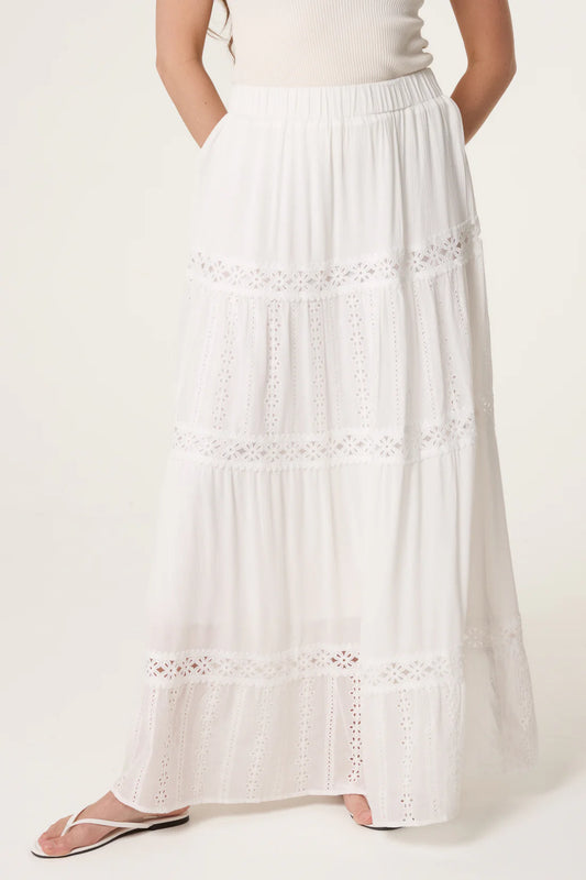 White White Broderie Anglaise Tiered Maxi Skirt worn by a person on a white background