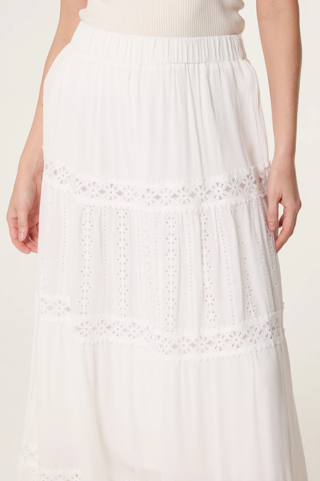 White Broderie Anglaise Tiered Maxi Skirt on a plain background